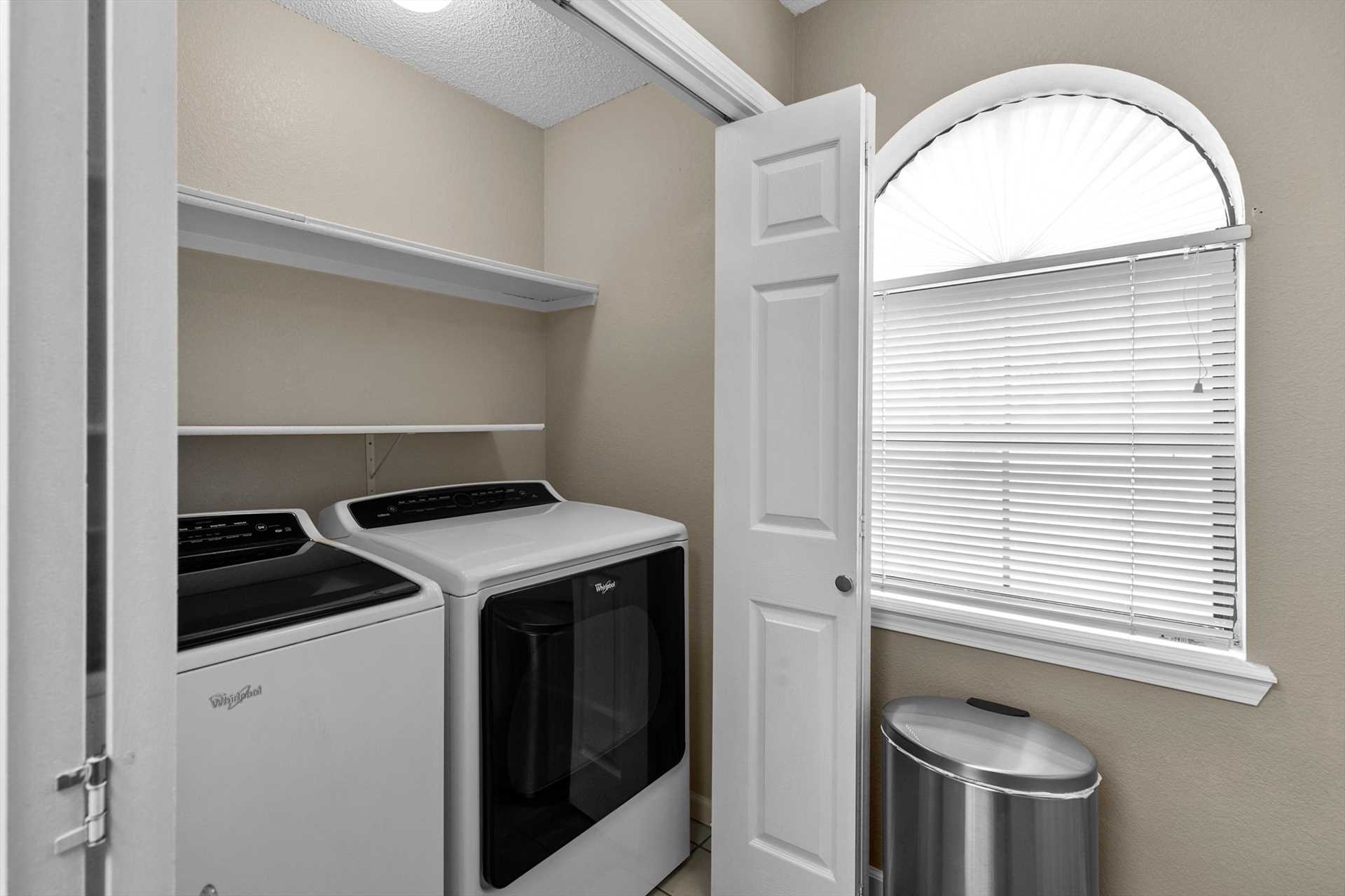 The full-size washer and dryer is located just off the kitch