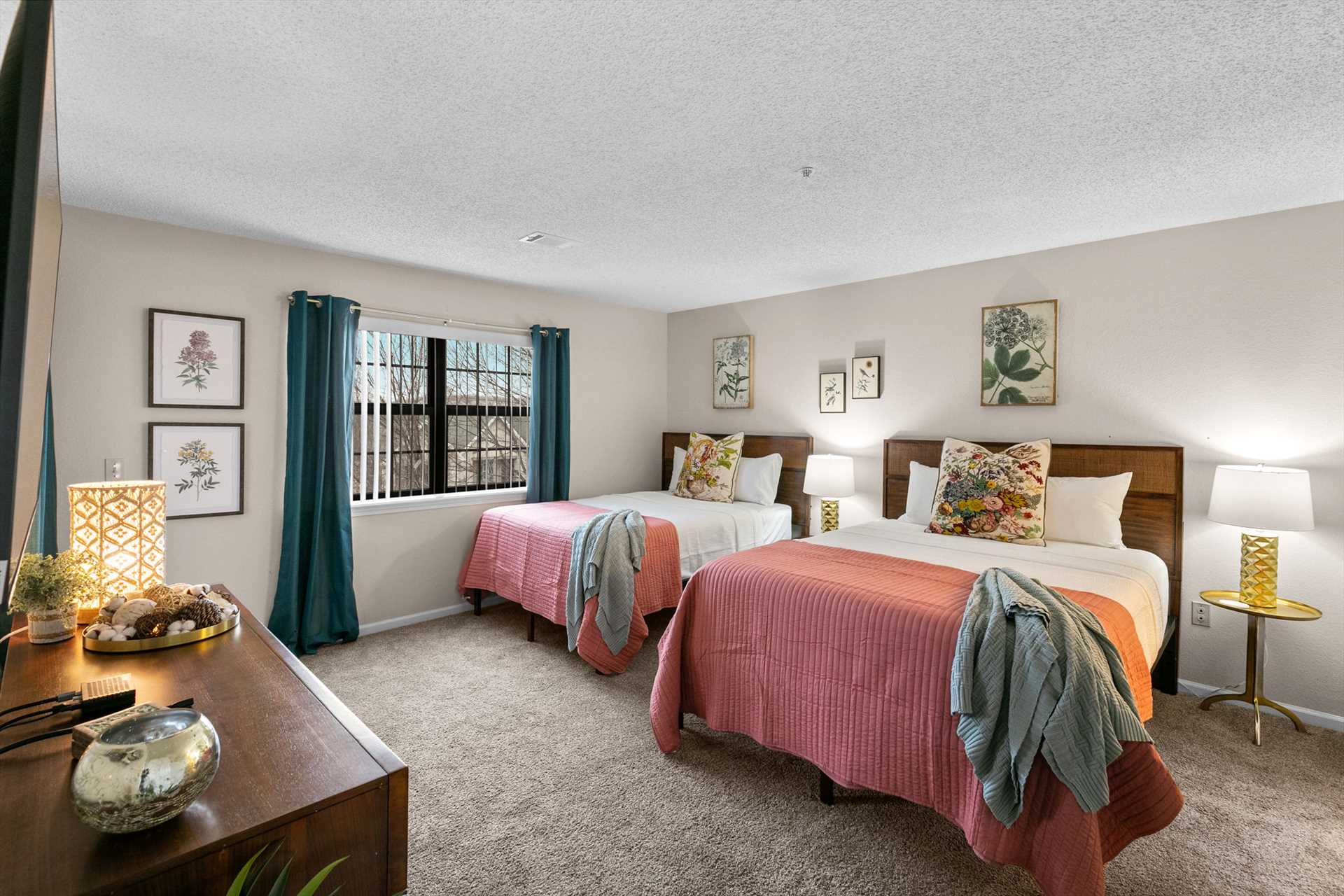 The first of the two bedrooms has a full and queen bed.